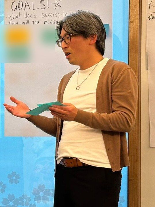 Yuzuru Ishikawa presenting at a workshop